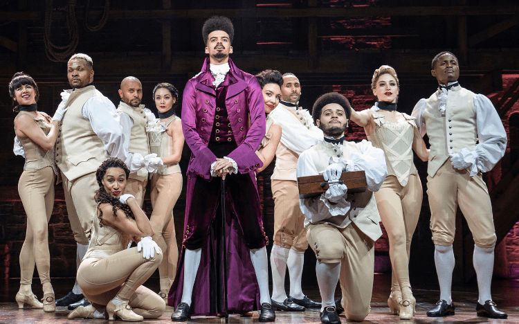 Sam Aberman (second from the right), performs six days a week with hit musical Hamilton alongside an MBA at UCLA Anderson