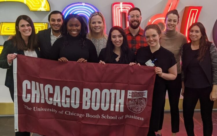 Chicago Booth MBA students holding banner at Google office