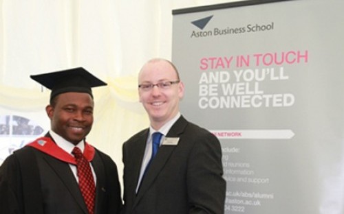 MBA Graduate Ayo Ajayi with Paul Hebron, Aston University's Alumni Relations Officer