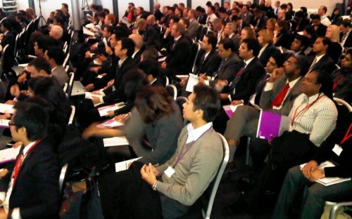 An attentive audience contemplate business opportunities, risks and bubbles