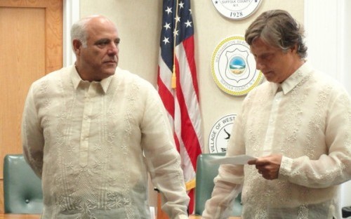 Frederic Rambaud, right, reads his vows to his long-term partner, Alan Ceppos, left. (Photo courtesy of Joseph Pincaro).