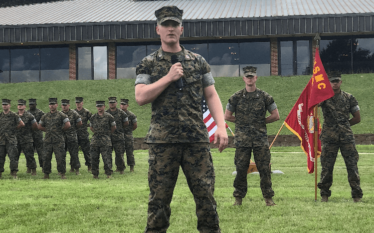Joseph (pictured) leveraged his military friendly MBA program to launch a Booz Allen Hamilton career. Image: man dressed in military uniform addressing other military members ©ODU