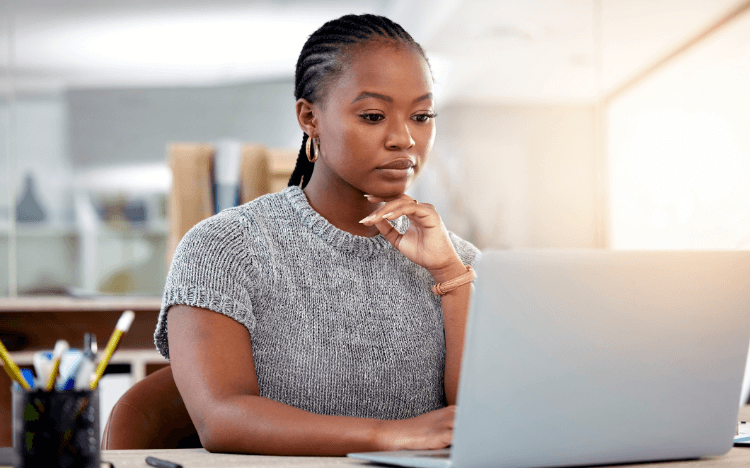 The current GMAT test and GMAT Focus Edition are taken online. (Image: A young woman at a computer ©iStock) 