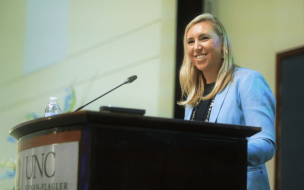 Charlie Burnett (pictured right) is forging a career in finance, but to her former classmates she's best known as a passionate community leader