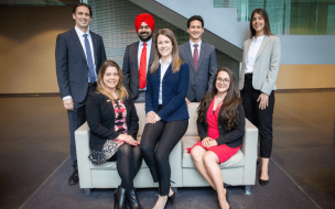 Amanda Rushton (center) and Geneviève Roch (left) honing the skills she needs for management consulting jobs through case competitions