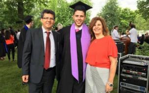 Vincent (center, with parents) graduated with an MBA from France’s HEC Paris in 2016