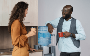 Water cooler conversations are the type of interaction missing from a remote-first work experience ©Shironosov / iStock