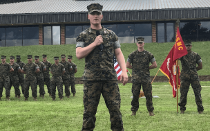 Joseph (pictured) leveraged his military friendly MBA program to launch a Booz Allen Hamilton career. Image: man dressed in military uniform addressing other military members ©ODU